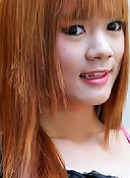 Fiery redheaded Asian tranny wanks and cums